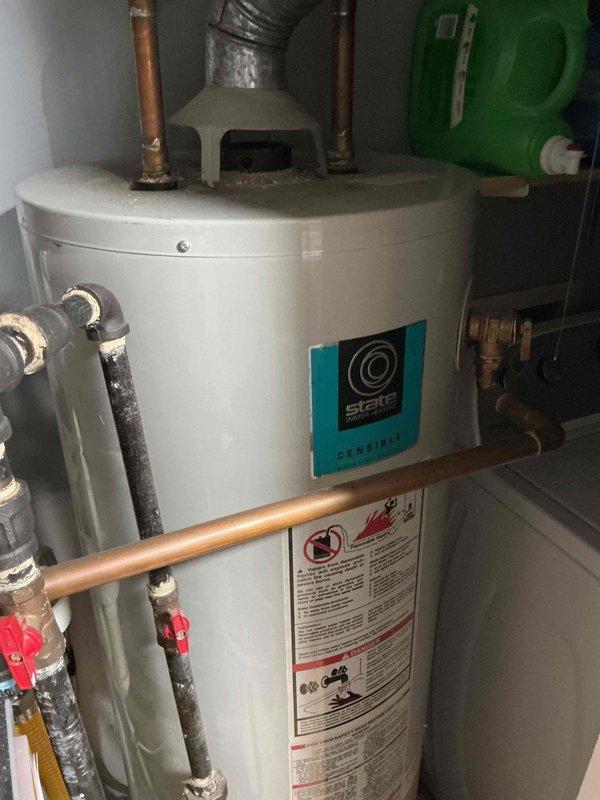 Completed plumbing estimate for tankless water heater replacement in garage apartment utility room. Assessed existing State brand gas-fired tank water heater with standard copper supply lines, gas control valve assembly, and flexible connector configuration. Provided comprehensive evaluation and pricing options for tankless water heater conversion, including necessary modifications to gas line sizing, venting requirements, and electrical supply considerations for the proposed installation.