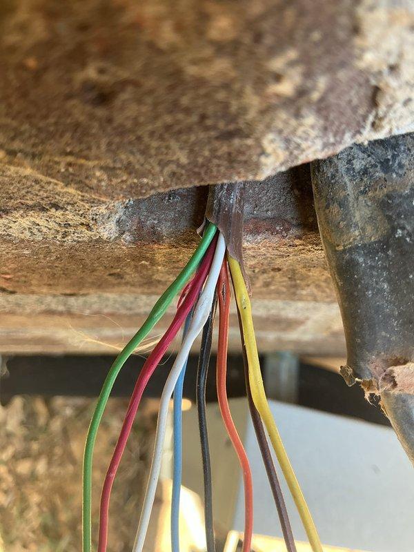 Responded to service call for central air conditioning system not cooling properly with frozen refrigerant line. Upon arrival, found 10-15 year old system with suction line freeze-up at exterior wall penetration. Performed diagnostic assessment of condensing unit and indoor air handler, inspecting electrical connections showing age-related corrosion at junction box and conduit. Evaluated refrigerant charge levels, airflow restrictions, and system operating pressures. Identified low refrigerant charge as primary cause of suction line icing. Recovered remaining refrigerant, performed leak detection on copper line set and coil connections, and repaired identified leak point. Evacuated system to proper vacuum levels, recharged unit to manufacturer specifications, and verified proper superheat and subcooling readings. Completed full preventative maintenance service including filter replacement, coil cleaning, condensate drain clearing, and electrical connection tightening. System restored t