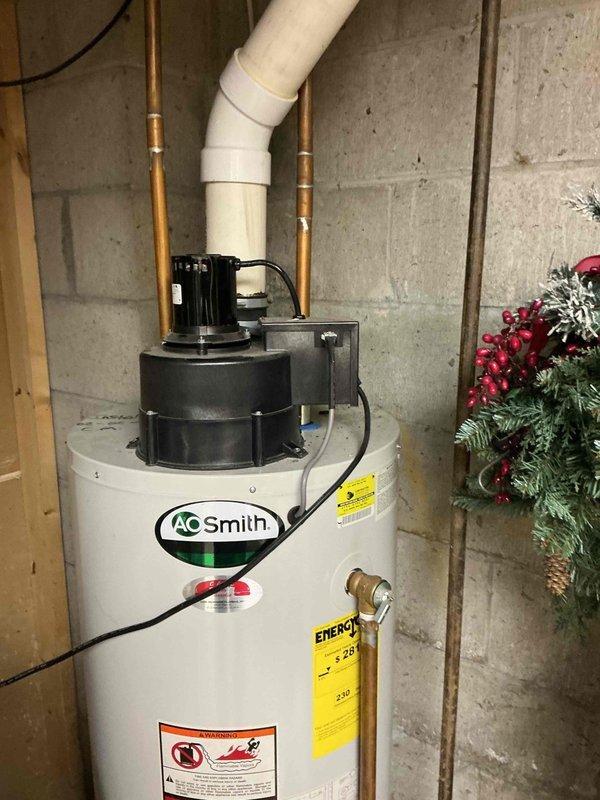 Conducted comprehensive plumbing estimate for 50-gallon gas water heater replacement. Existing AO Smith unit, installed in February 2015, is experiencing ignition failure and requires replacement. Evaluated installation site, existing copper supply lines, brass connections, and venting configuration. Additionally assessed feasibility for installing on-demand tankless solutions for shower and kitchen sink applications as requested by homeowner.