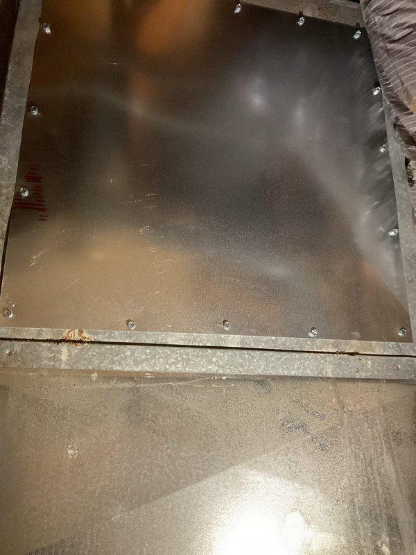 Completed annual maintenance service on 9-year-old system with AprilAire 2400 filter. Inspected mechanical room including water heater, plumbing connections, and ventilation components. Accessed and examined HVAC equipment panels to verify proper installation and condition, noting some minor corrosion on mounting frame that remains within acceptable parameters.