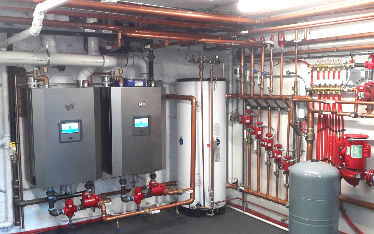 Commercial snow melt boiler system in operation during winter in Chicago