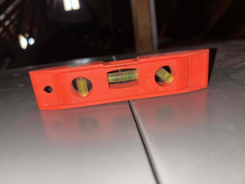 Completed installation of new RED complete HVAC system in basement area. Conducted full system level verification using spirit level to ensure proper unit orientation. Performed comprehensive CAM check on unit with proper connections to existing ductwork. Documented installation with photos showing proper mounting and alignment of system components.