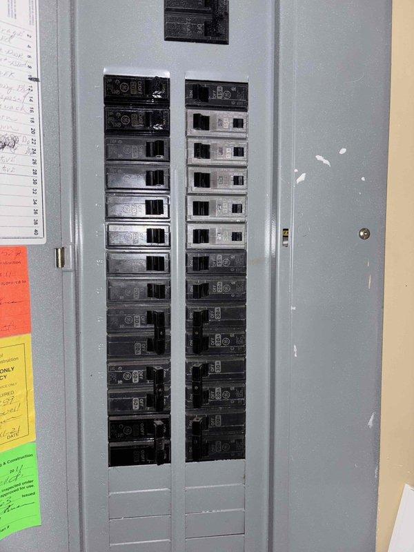 Conducted site assessment for propane generator installation, evaluating existing electrical infrastructure including 200A service panel with approximately 20-24 circuit breakers. Customer requires generator estimate for backup power system and previously inquired about HVAC solutions for two bedrooms. Documented panel configuration and load distribution to determine appropriate generator sizing and transfer switch requirements.