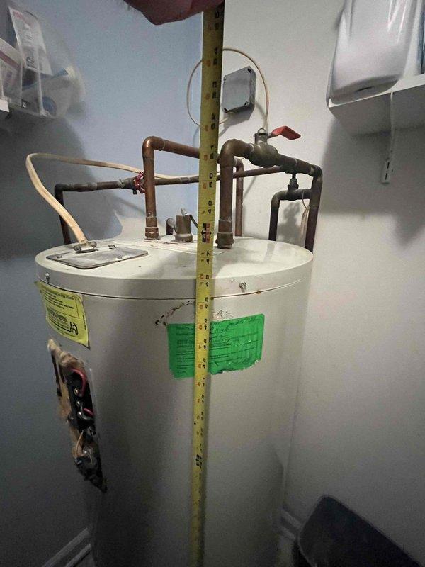 Shelbyville, KY - Completed comprehensive inspection of existing 50-gallon electric water heater. Assessed unit dimensions, connection integrity, and overall condition. Documented age-related wear on copper components while confirming system remains functional; provided detailed replacement options and recommendations based on household needs and current installation configuration.