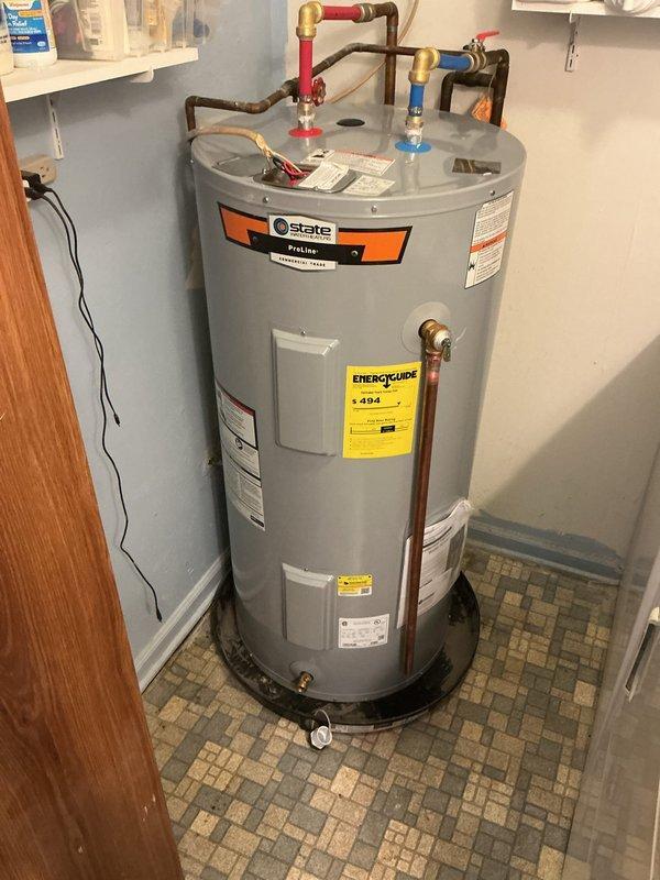 Shelbyville, KY - Successfully installed a State brand 50-gallon electric water heater in utility closet. Completed all plumbing connections with proper hot/cold water lines and verified proper operation. Unit was properly positioned on tiled floor with appropriate clearances maintained.