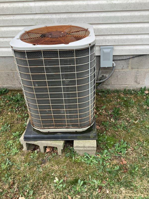 # HVAC Replacement Estimate Report

Completed comprehensive replacement estimate for residential HVAC system at customer's request. Homeowner present during evaluation as required for replacement consultation. Customer indicated current system is non-operational and specifically requested replacement options only, declining repair assessment.

Conducted thorough inspection of existing outdoor air conditioning condenser unit and indoor air handler components. Exterior condenser unit exhibits significant age-related deterioration with visible weathering, dirt accumulation on protective grilles, and general wear consistent with end-of-service-life equipment. Unit positioned on concrete pad adjacent to structure with standard electrical conduit connections. Interior inspection revealed aging heat exchanger coil assembly with visible discoloration, dust buildup, and signs of extended operational wear. Examined control board, wiring connections, and drip pan assembly within cabinet compartme