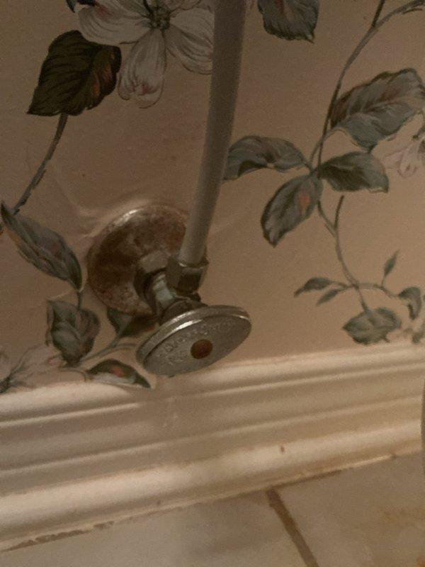 Responded to emergency water leak originating from first-floor bathroom toilet that was penetrating through the wall and ceiling into the basement below. Upon arrival, inspected the toilet supply line and shut-off valve, which showed signs of age and deterioration consistent with the 12-year-old home. Identified the source of the leak at the toilet supply connection point and immediately shut off the water supply to prevent further damage. Replaced the faulty supply line and shut-off valve assembly, ensuring proper sealing and connection to eliminate active leaking. Verified all connections were secure and tested the system under pressure to confirm the repair was successful with no additional leaks detected. Additionally addressed the secondary concern of a slow-draining toilet by inspecting the tank components and flush valve mechanism, finding mineral buildup and worn flapper assembly affecting drainage performance. Cleaned deposits from the flush valve and adjusted the fill valve t