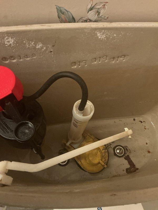 Responded to emergency water leak originating from first-floor bathroom toilet that was penetrating through the wall and ceiling into the basement below. Upon arrival, inspected the toilet supply line and shut-off valve, which showed signs of age and deterioration consistent with the 12-year-old home. Identified the source of the leak at the toilet supply connection point and immediately shut off the water supply to prevent further damage. Replaced the faulty supply line and shut-off valve assembly, ensuring proper sealing and connection to eliminate active leaking. Verified all connections were secure and tested the system under pressure to confirm the repair was successful with no additional leaks detected. Additionally addressed the secondary concern of a slow-draining toilet by inspecting the tank components and flush valve mechanism, finding mineral buildup and worn flapper assembly affecting drainage performance. Cleaned deposits from the flush valve and adjusted the fill valve t