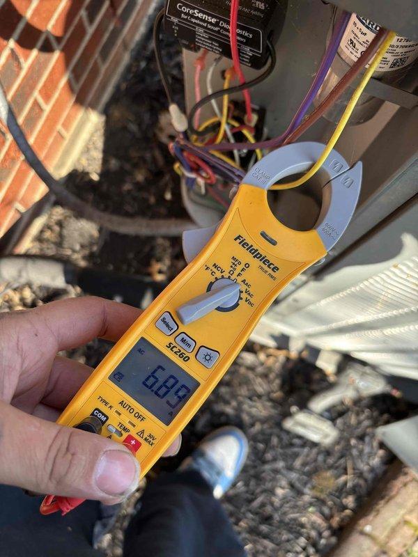 Performed comprehensive HVAC system maintenance and tune-up on operational air conditioning unit as requested. Conducted electrical diagnostics using clamp meter, measuring amperage draw and voltage readings at the condensing unit to verify proper system performance. All measurements fell within manufacturer specifications, confirming system is operating efficiently with no immediate service concerns identified.