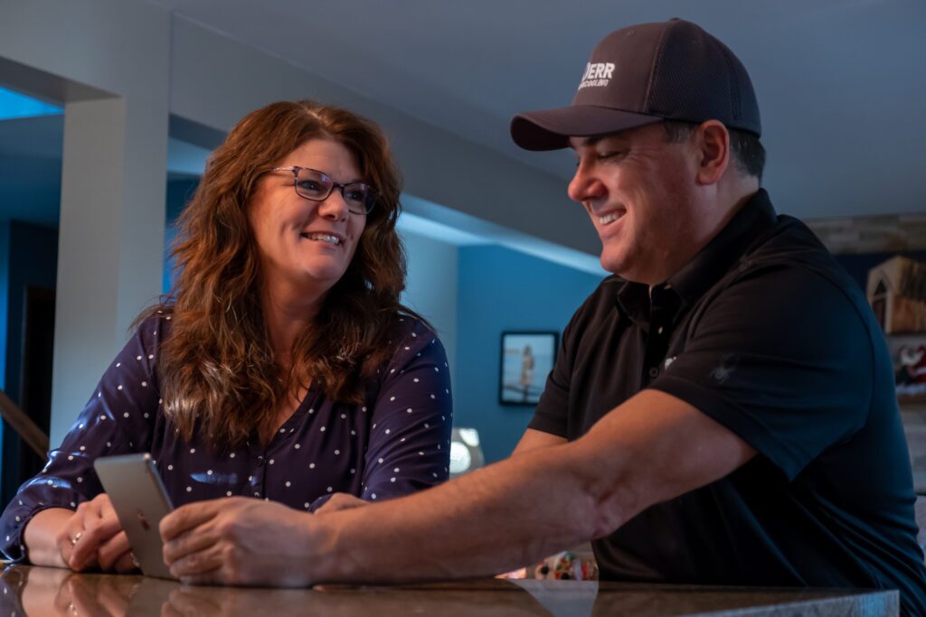 Plumber talking to client