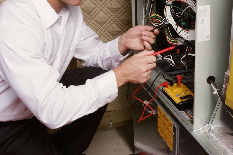 Close-up of a modern gas furnace installed in a utility room