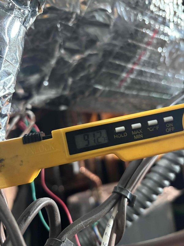 Bardstown, KY - Responded to follow-up service call regarding heat pump defrost cycle concerns. Customer reported approximately 1/2 inch ice accumulation on outdoor unit blades. Diagnostic testing with multimeter confirmed system voltage reading of 91.3V at defrost control board, indicating proper power supply to defrost circuit. Verified defrost cycle operation and provided education on normal winter performance expectations.
