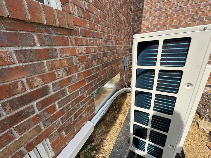 Santa Claus, IN - Successfully installed an 18,000 BTU mini split system (1:1 configuration) on a brick exterior wall. The outdoor condenser unit was properly mounted on a concrete pad with appropriate clearances, and line set was routed along the wall using white PVC line hide for protection and aesthetic finish. System was pressure tested, evacuated, and charged according to manufacturer specifications, with final commissioning confirming proper operation.