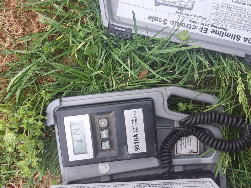 Responded to no-cool service call for system failing to maintain setpoint temperature with 4-degree differential. Performed comprehensive system diagnostic including airflow verification and refrigerant charge analysis. Utilized electronic charging scale to measure and assess refrigerant levels in outdoor condensing unit. System showed adequate airflow through supply registers with no evaporator coil icing present. Evaluated refrigerant charge using precision scale equipment to determine if low charge was contributing to reduced cooling capacity and inability to reach thermostat setpoint.