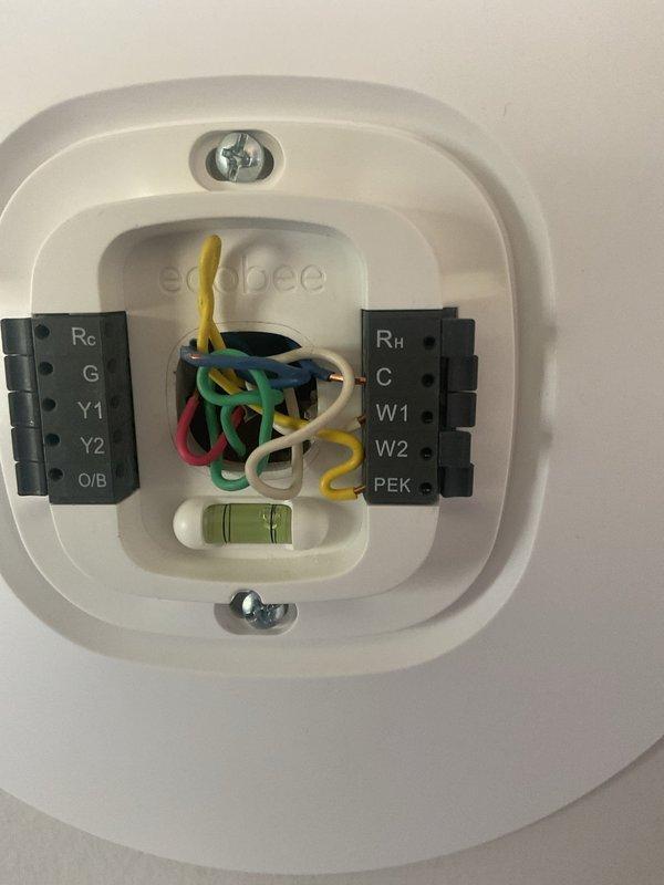 Completed comprehensive estimate for full HVAC system replacement on residential property with over 15-year-old equipment. Evaluated existing furnace and air conditioning system in utility room where blower motor had failed due to improperly wired ecobee thermostat causing continuous operation. Assessed current equipment configuration including ductwork connections, PVC venting, and electrical wiring to determine replacement specifications and provided detailed quote for new heating and cooling system installation.