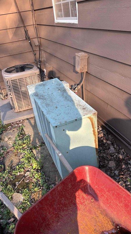 Conducted comprehensive HVAC system evaluation for complete equipment replacement at residential property with non-functional upstairs air conditioning unit and aging outdoor equipment. Assessed attic space containing existing ductwork and insulation conditions, noting flexible duct routing and structural access points for future installation. Evaluated exterior condensing units showing significant rust deterioration and weathering, indicating end-of-service-life conditions requiring replacement. Provided estimates for complete HVAC system upgrade including new heating and cooling equipment, thermostat replacements, and integration solutions to connect upstairs and main level climate control systems into cohesive whole-home comfort solution.
