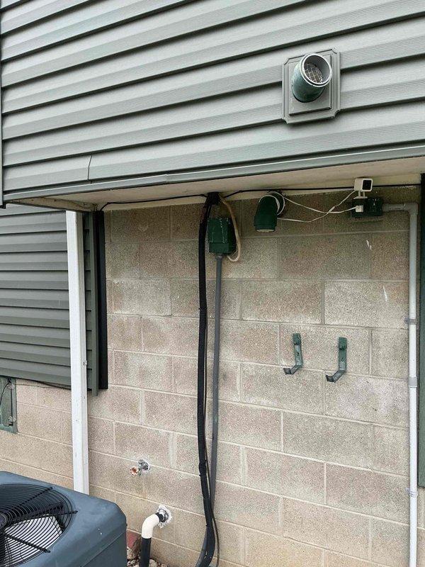 Completed on-site plumbing estimate for electric water heater replacement and laundry room reconfiguration. Evaluated existing 50-gallon electric AO Smith tank water heater located in basement utility area and assessed feasibility of converting to tankless electric system. Provided estimate options for both tank and tankless configurations, including necessary electrical upgrades, venting modifications, and code compliance requirements. Assessed additional scope for relocating washer supply hoses and drain lines in same area as water heater to optimize laundry room layout. Documented existing plumbing connections, electrical service capacity, available space constraints, and structural considerations for equipment placement. Photographed current installation including water heater, supply and discharge piping, electrical connections, surrounding mechanical systems, and proposed work areas. Reviewed with homeowner the advantages and disadvantages of tank versus tankless systems, includi