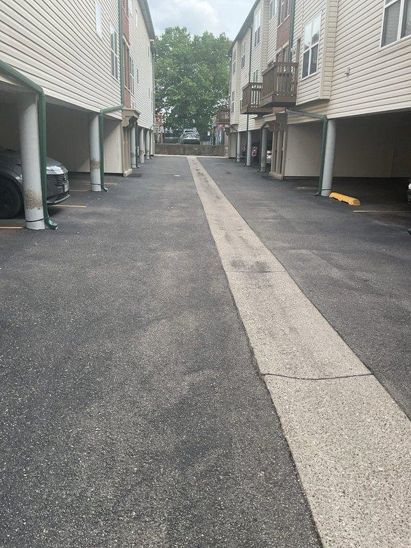 Conducted comprehensive HVAC system replacement estimate at multi-unit residential property. Performed detailed assessment of existing equipment configuration, measured current insulation levels showing approximately 23-24 inches of fiberglass insulation at furnace location, and documented equipment accessibility in covered carport area. Evaluated system specifications and site conditions to provide homeowner with complete replacement options and recommendations for new HVAC installation.