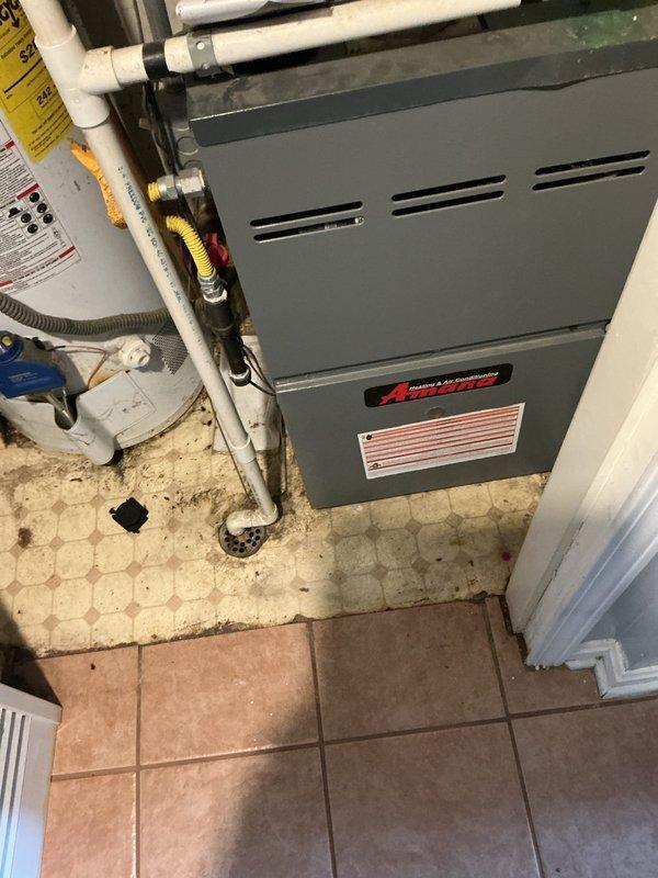 Responded to service call for HVAC system failing to cool effectively, with thermostat set to 70 degrees while indoor temperature reached 80 degrees. Upon arrival, conducted diagnostic evaluation of split system consisting of Amana furnace with air handler and outdoor condensing unit. Customer reported compressor producing humming sound with condenser fan failing to operate.

Performed comprehensive system inspection revealing outdoor condensing unit exhibiting advanced corrosion and deterioration on exterior casing, indicating significant age and exposure damage. Diagnosed failed condenser fan motor preventing proper heat rejection and airflow across condenser coil. Compressor attempting to operate but unable to function efficiently without proper ventilation and cooling from fan operation. Verified electrical connections at disconnect box and confirmed no tripped breakers or power supply issues.

Given the extensive rust damage to outdoor unit cabinet, age of existing Amana equipment