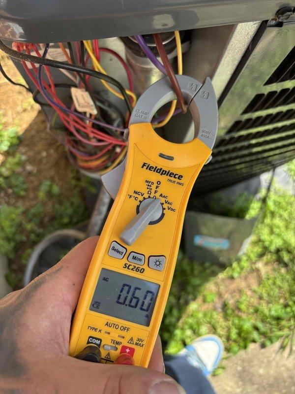 Completed complimentary HVAC system maintenance as requested via scheduled appointment. System was reported as currently operating properly upon arrival. Performed comprehensive tune-up service including electrical diagnostics using clamp meter to verify amperage readings on system components. Measured and documented electrical current draw, recording readings of 86.0 and 34.98 amps at various points in the system to ensure proper operation within manufacturer specifications. Inspected all electrical connections, wiring bundles, and terminal points for secure connections and proper condition. Examined refrigerant lines with foam insulation for integrity and proper installation. Verified condenser coil fins and heat exchanger components for cleanliness and proper airflow. System tested and confirmed to be functioning within normal operating parameters with no issues identified requiring immediate attention.