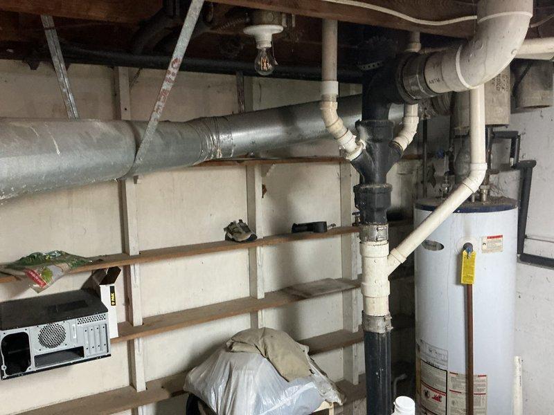 Conducted comprehensive HVAC replacement estimate for a 21-year-old non-operational system. Assessed existing equipment located in basement utility area, evaluated current ductwork configuration and thermostat setup, and documented system conditions through photographic documentation. Provided homeowner with replacement options and recommendations based on equipment age and system failure.