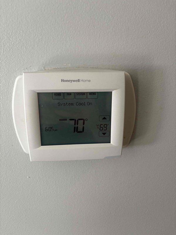 Louisville, KY - Responded to callback for recently installed system reporting no cooling, burning smell at thermostat, and smoke alarm activation. Upon arrival, inspected Honeywell Home programmable thermostat and wiring connections for signs of electrical failure or short circuit. Identified and corrected wiring issue causing overheating condition at thermostat terminal block. Verified all connections were properly seated and torqued to manufacturer specifications. System tested successfully with cooling mode operating normally, displaying 78°F ambient temperature at time of departure with no abnormal odors or smoke detected.
