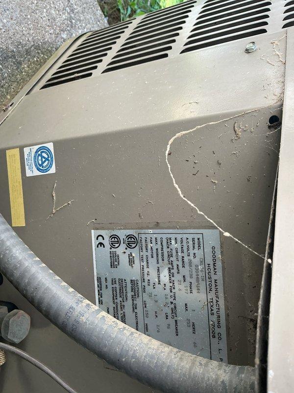 Responded to no cooling complaint on 23-year-old residential HVAC system with thermostat set to 68°F but unit blowing warm air. Performed diagnostic evaluation of outdoor condensing unit showing significant age-related deterioration with visible cracking on exterior panel and weathered components. Inspected indoor air handler and associated ductwork in mechanical space, verified no tripped breakers, confirmed absence of evaporator coil ice formation, and assessed refrigerant lines and electrical connections. System exhibited failed cooling capacity consistent with end-of-service-life equipment requiring replacement recommendation due to age and condition of critical components.
