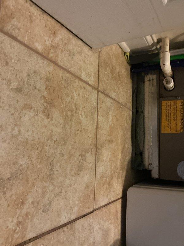 Responded to no cooling complaint on 23-year-old residential HVAC system with thermostat set to 68°F but unit blowing warm air. Performed diagnostic evaluation of outdoor condensing unit showing significant age-related deterioration with visible cracking on exterior panel and weathered components. Inspected indoor air handler and associated ductwork in mechanical space, verified no tripped breakers, confirmed absence of evaporator coil ice formation, and assessed refrigerant lines and electrical connections. System exhibited failed cooling capacity consistent with end-of-service-life equipment requiring replacement recommendation due to age and condition of critical components.