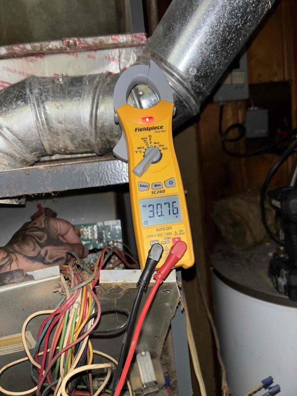 Responded to no cooling complaint on system that was experiencing intermittent startup issues since previous summer. Performed diagnostic testing using digital multimeter on HVAC electrical controls and measured system amperage with clamp meter, recording readings of 38.76 and 30.02 respectively. Observed active condensation on supply ductwork indicating system was operational during testing, and inspected control board wiring and connections to identify cause of intermittent operation.