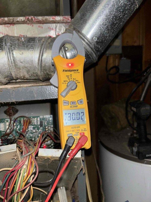 Responded to no cooling complaint on system that was experiencing intermittent startup issues since previous summer. Performed diagnostic testing using digital multimeter on HVAC electrical controls and measured system amperage with clamp meter, recording readings of 38.76 and 30.02 respectively. Observed active condensation on supply ductwork indicating system was operational during testing, and inspected control board wiring and connections to identify cause of intermittent operation.