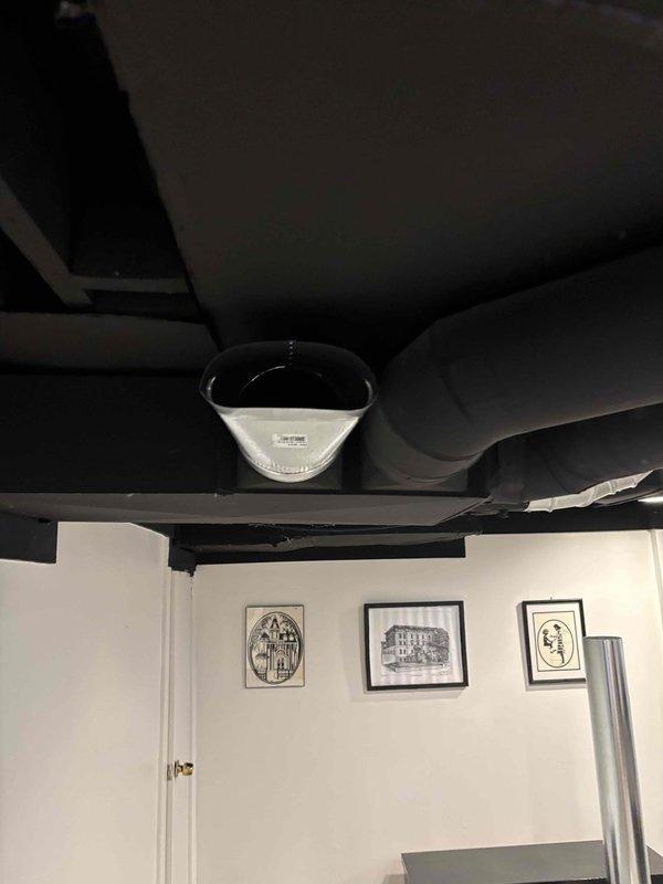 Completed full HVAC system installation including new air handler unit positioned in utility room corner with black flexible ductwork connections routed to ceiling plenum. Installation included complete duct runs with reflective insulation wrapping applied to exposed ductwork in conditioned living spaces to maximize thermal efficiency and minimize heat loss/gain. System commissioned and tested for proper airflow and operation upon completion.