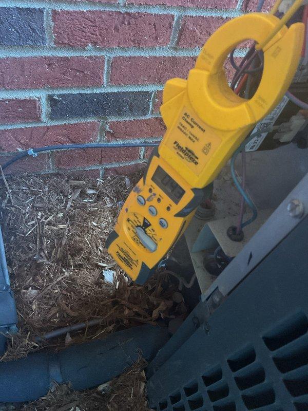 Completed routine planned maintenance on five-year-old residential HVAC system including both air conditioning and heating components. Performed comprehensive AC tune-up with electrical testing using clamp meter to verify proper amperage draw and system performance. Inspected outdoor condensing unit, confirmed operational status of fan motor and compressor, and noted debris accumulation in unit housing that was addressed during service to ensure optimal airflow and efficiency.