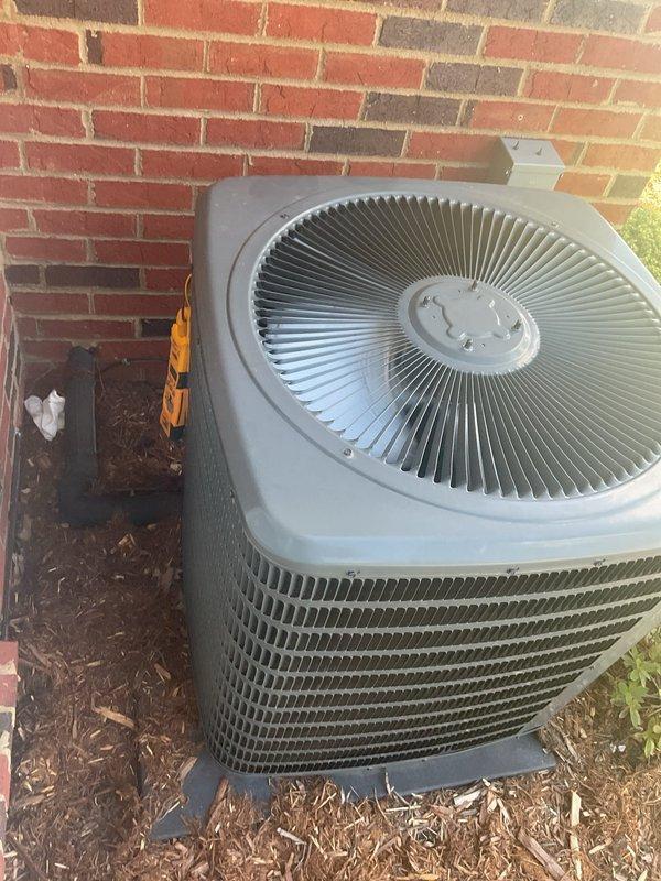 Completed routine planned maintenance on five-year-old residential HVAC system including both air conditioning and heating components. Performed comprehensive AC tune-up with electrical testing using clamp meter to verify proper amperage draw and system performance. Inspected outdoor condensing unit, confirmed operational status of fan motor and compressor, and noted debris accumulation in unit housing that was addressed during service to ensure optimal airflow and efficiency.