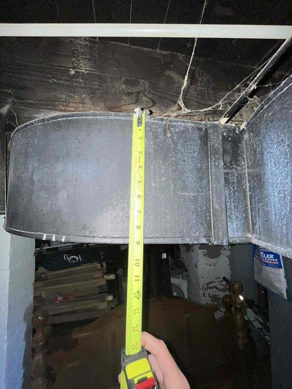 Conducted on-site assessment for HVAC system relocation within basement area to accommodate remodeling and finishing project. Evaluated existing furnace, ductwork configuration, and mechanical equipment placement in current central basement location. Documented clearance measurements, ductwork routing, and structural considerations for relocating system to alternate basement area. Photographed existing installation including plenum connections, rectangular trunk lines, PVC condensate piping, and equipment positioning to develop comprehensive relocation estimate accounting for new duct runs, electrical modifications, and proper clearances in proposed location.