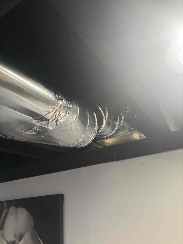 Completed installation of HVAC ductwork in basement and attic spaces. Installed rigid metallic ductwork in finished basement area with proper support strapping and secured flexible aluminum ductwork in attic cavity with appropriate fastening and metallic tape at connection points. All ductwork properly positioned and secured to ensure optimal airflow and system performance.