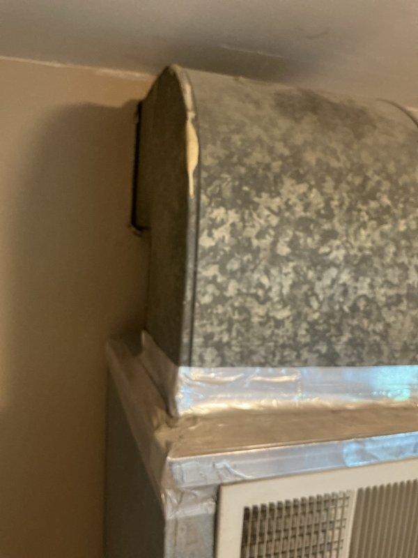 Conducted comprehensive assessment of existing HVAC system for replacement estimate. Documented current equipment configuration including ductwork connections, air handling components, and window-mounted AC unit with associated condensate drainage system. Evaluated installation conditions and provided detailed photographic documentation to support Green A+ replacement proposal.