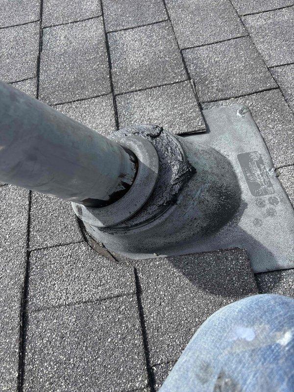 Louisville, KY - Completed roof vent modification by shortening PVC pipe penetration to proper height and verifying integrity of rubber boot flashing seal around pipe. Inspected asphalt shingle roofing surrounding penetration point to confirm weatherproof installation and documented completed work with photos.