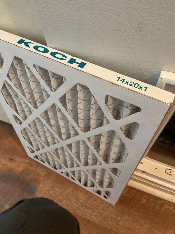 Completed scheduled air conditioning tune-up and preventative maintenance service. Inspected HVAC system components including furnace unit, ductwork connections, and air handling equipment in mechanical room. Replaced 14x20x1 air filter with new KOCH brand filter to ensure proper airflow and system efficiency.