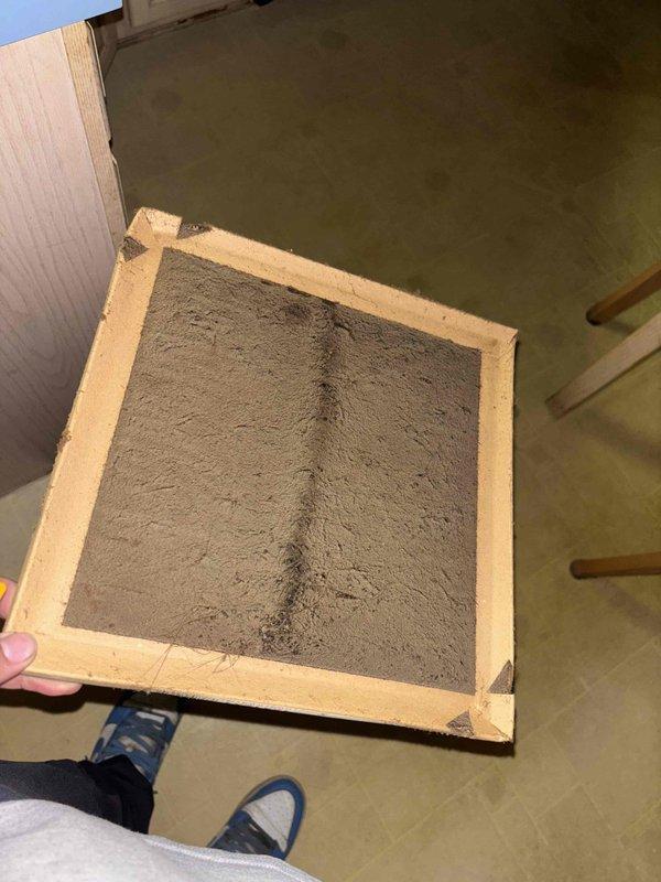 Responded to no cooling complaint with system blowing room temperature air. Upon inspection, discovered heavily clogged air filter restricting airflow to the system. Measured supply air temperature at 89.88°F, confirming lack of cooling output. Recommended filter replacement to restore proper airflow and system operation.