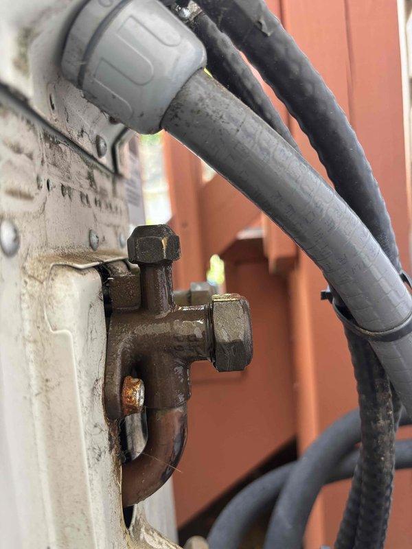 Conducted follow-up site visit to document and assess incomplete HVAC installation work. Performed visual inspection and photographed mechanical connections, pipe fittings, and conduit assemblies showing evidence of weathering, corrosion on brass fittings, and aging components requiring attention before project completion.
