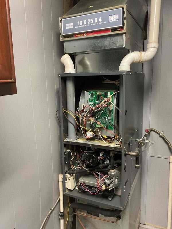 Completed planned maintenance visit on 8-year-old HVAC system. Removed furnace front panel and accessed internal components for inspection. Verified 16x25x4 polarized filter housing and checked control board connections, including orange, yellow, and white wire terminations. Inspected blower motor assembly, gas line connections, and PVC condensate drainage system. All mechanical and electrical components operating within normal parameters. System returned to service.